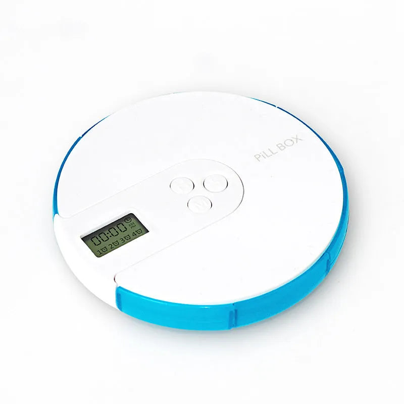 Blue seven-day alarm clock pill dispenser with digital display, showing daily compartments and measuring 11cm wide.