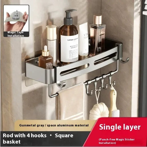 Gun Gray metal corner storage rack mounted on a bathroom wall, holding toiletries.