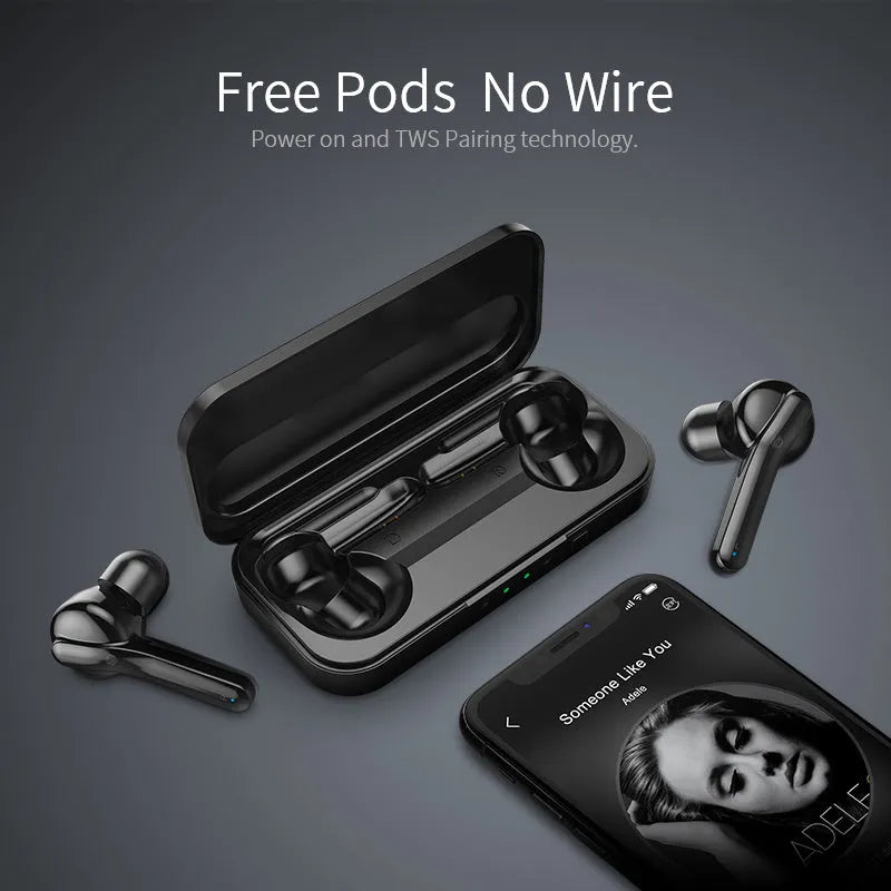 Black and white true wireless stereo earbuds with a compact charging case on a table.