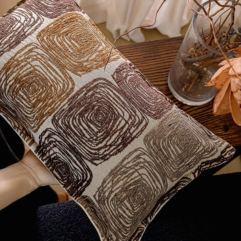 Cream and coffee coloured abstract coil pattern pillow cover in square and lumbar sizes.