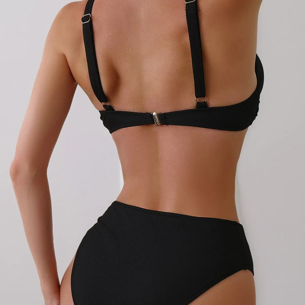 Women's solid colour rib fabric two-piece bikini set on a white background.