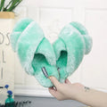 Women's cross open-toe fur slippers in assorted colours on a patterned non-slip sole.