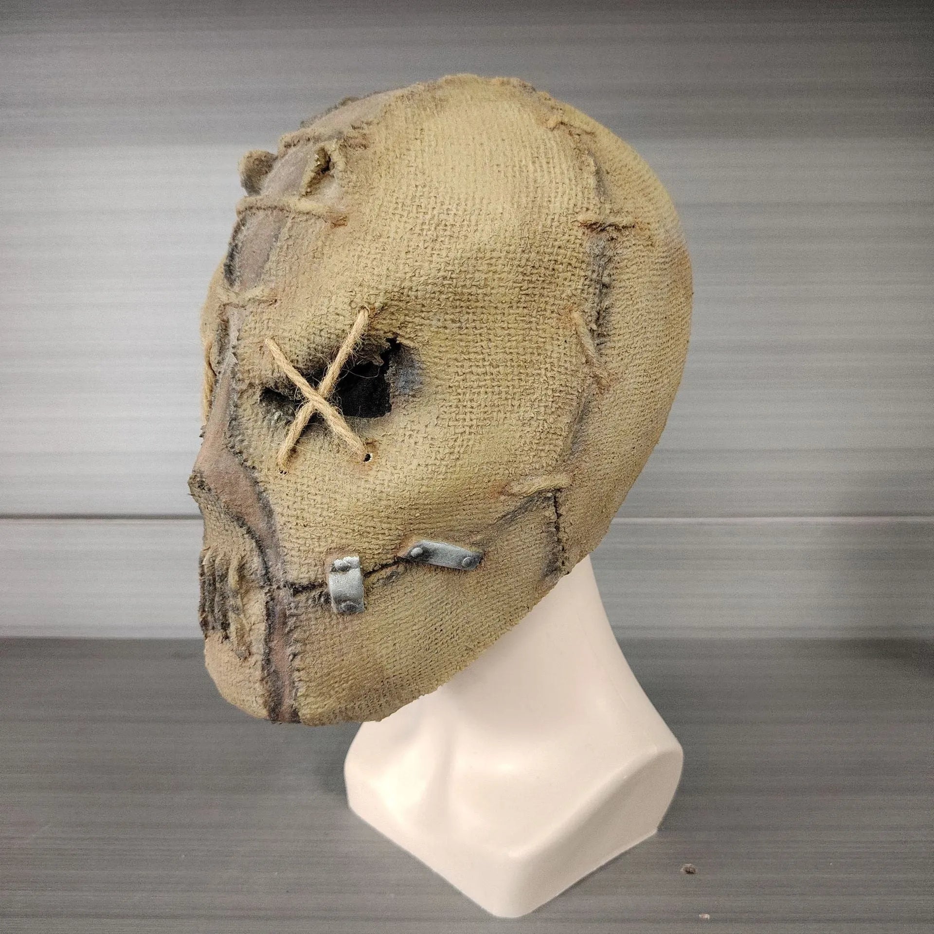 Latex Halloween mask featuring a detailed scar skull design, shown as a full head cover.