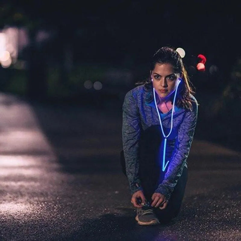 Blue LED light-up earphones with 3.5mm plug and remote control, flashing in sync with music.