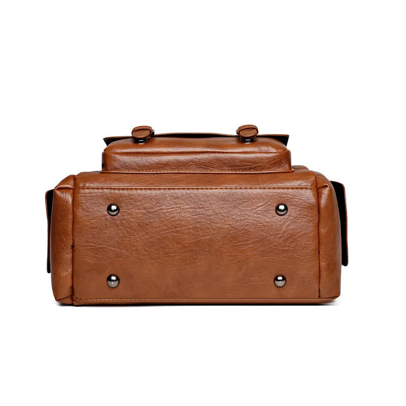 Vintage style messenger bag in PU leather, shown in a horizontal square shape with contrast stitching.
