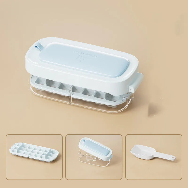 A high-capacity blue ice cube tray with a leverage-action lid and a stored ice shovel.
