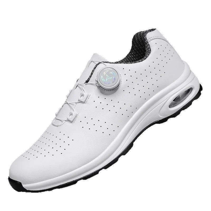 Black and white low-top tennis shoes with mesh upper and composite sole.