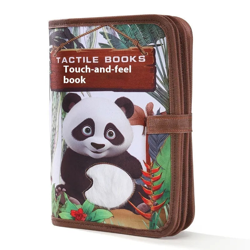 Infant touching textured page of animal sound book with colourful illustrations and button