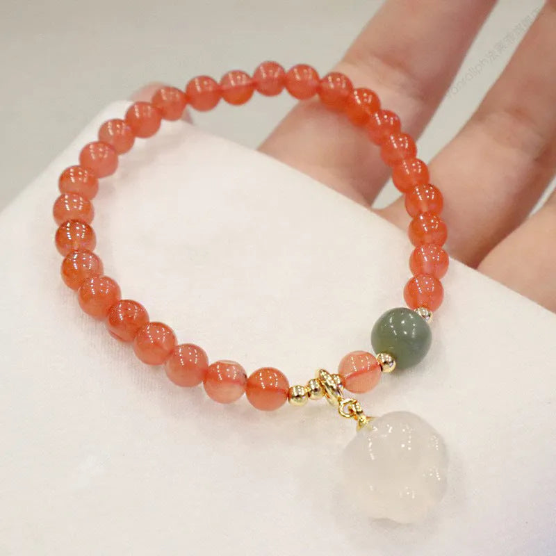 Red agate women's bracelet with cat's paw charm and jade inlay on 6mm band