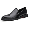 Men's polished pointed black leather shoes with leather toe cap and rubber sole, side view