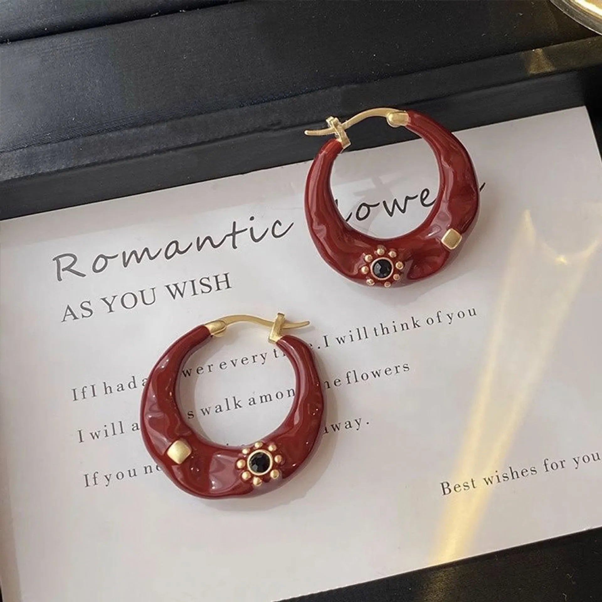 Hong Kong style retro ear studs with rhinestone inlay and dripping oil texture in black and red colours