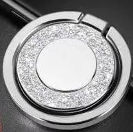 Sparkling bling glitter metal phone holder ring showing rotation, attached to a smartphone.