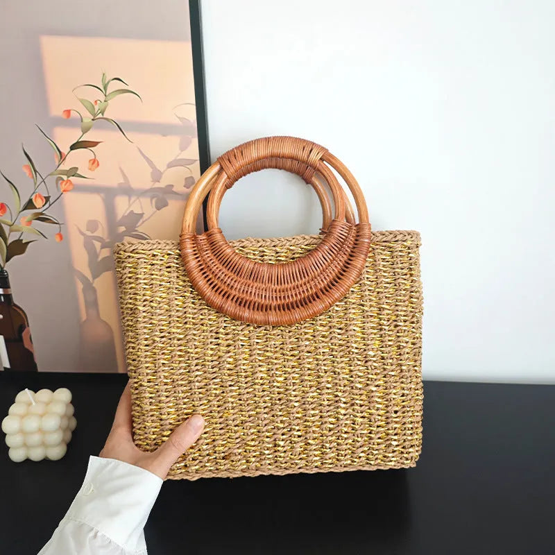 Handmade woven paper straw bag with double shoulder straps in gold and natural tones