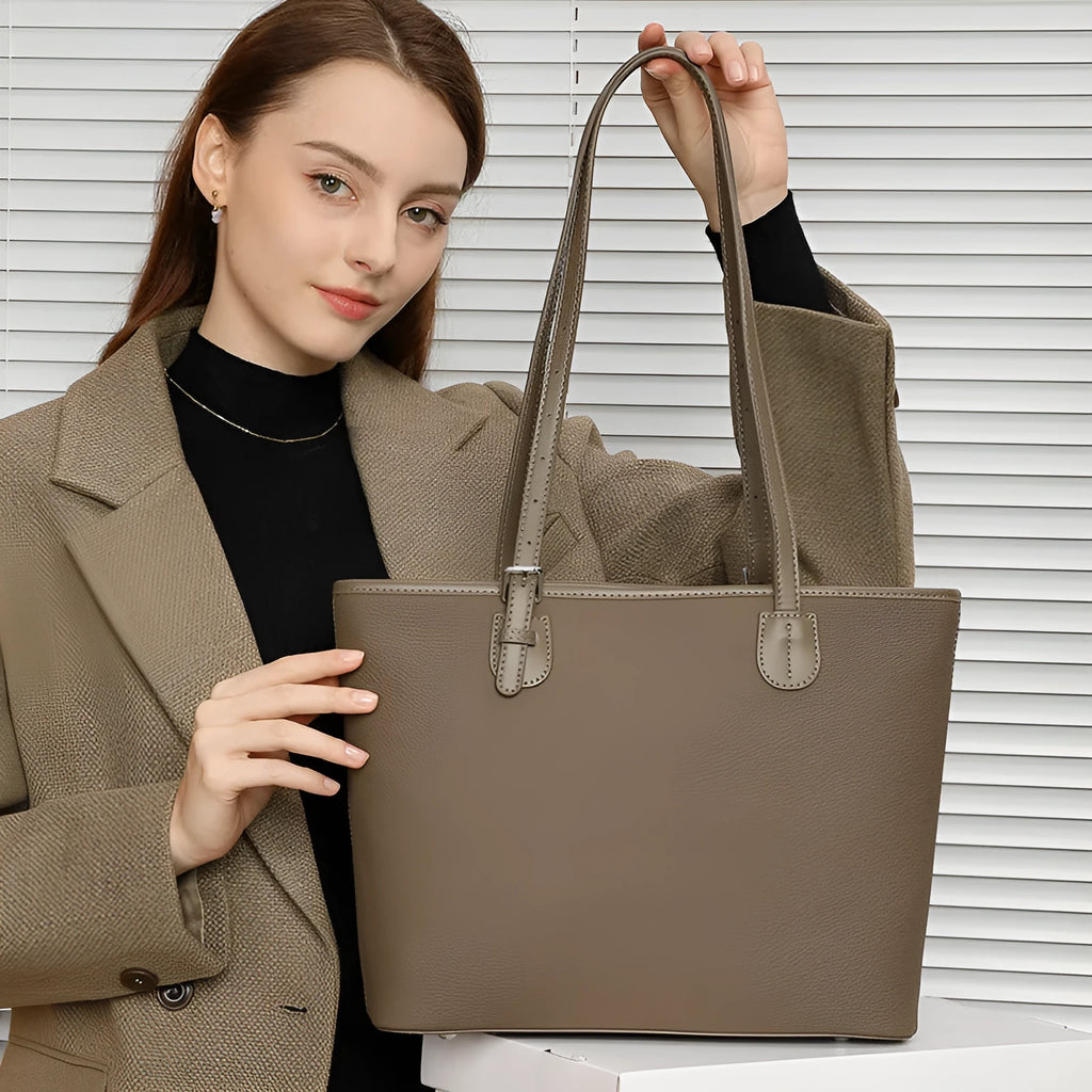 Genuine leather women's tote bag with multiple internal compartments showing document and phone pockets