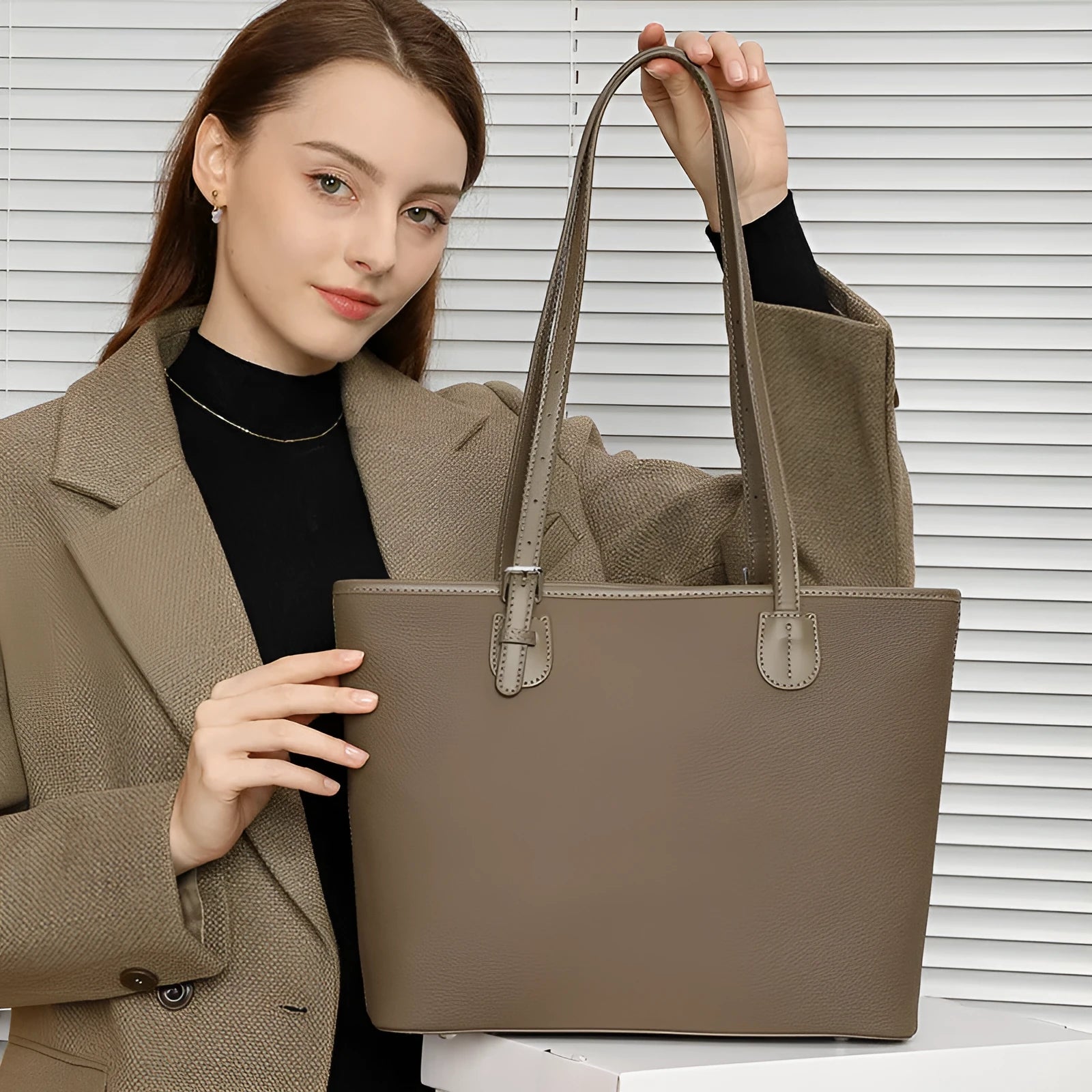 Genuine leather women's tote bag with multiple internal compartments showing document and phone pockets