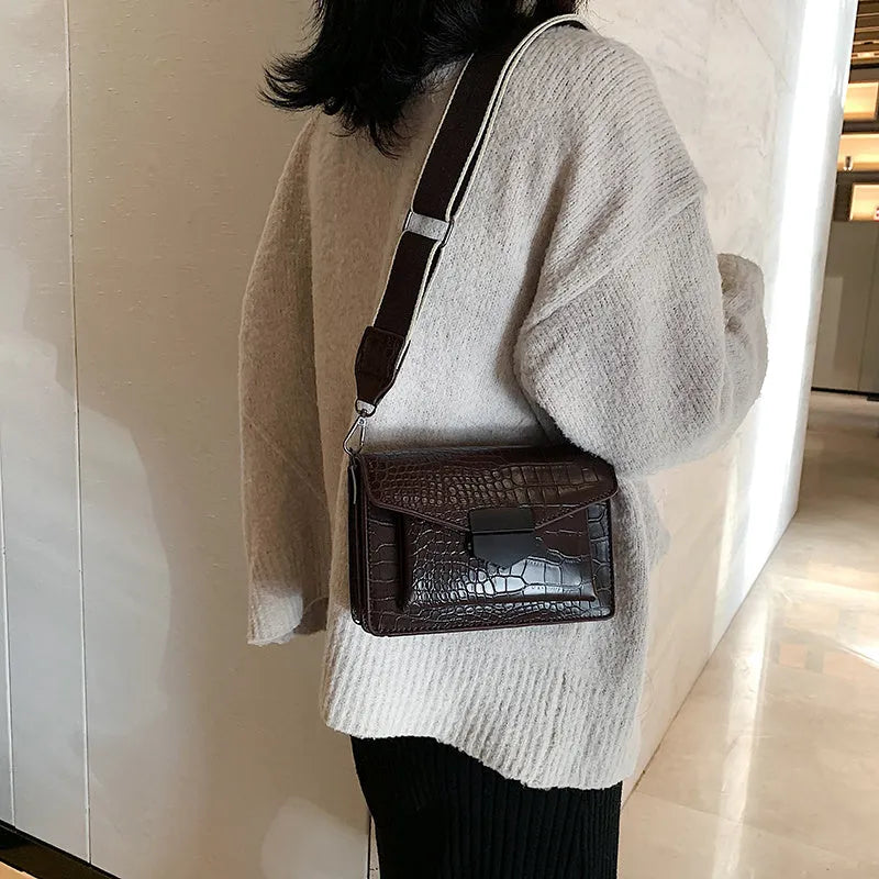 Vintage-style PU leather crossbody bag in black, shown with dimensions for scale.