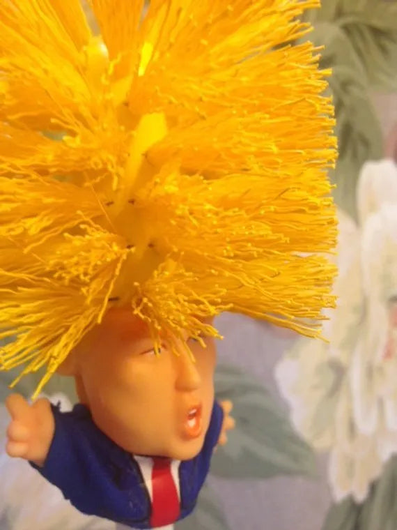 Yellow plastic Donald Trump novelty toilet brush with hanging slot, 40cm length