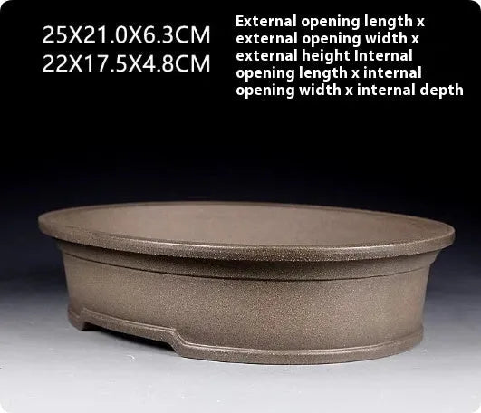 Handmade antique oval bonsai flower pot in purple sand ceramic, 25cm long by 21cm wide.