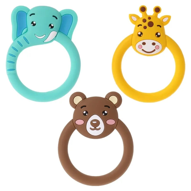 Three silicone baby molar teethers in brown, blue, and yellow on a white background