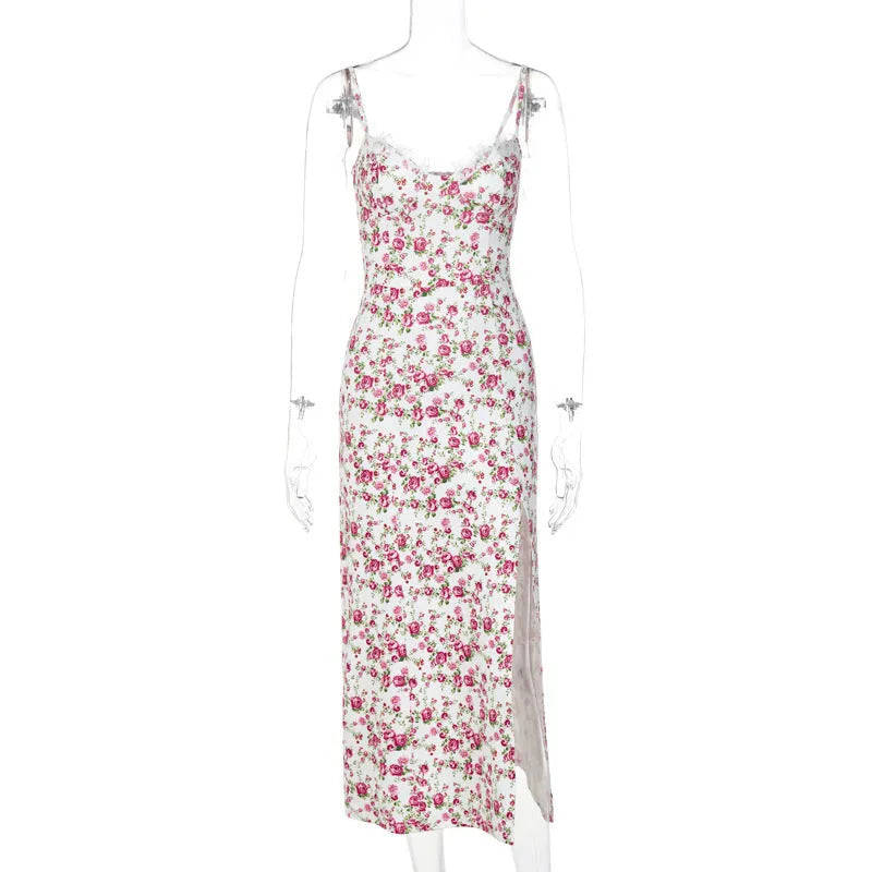 Blue long dress with white lace flower print, featuring a thigh slit and thin suspender straps.