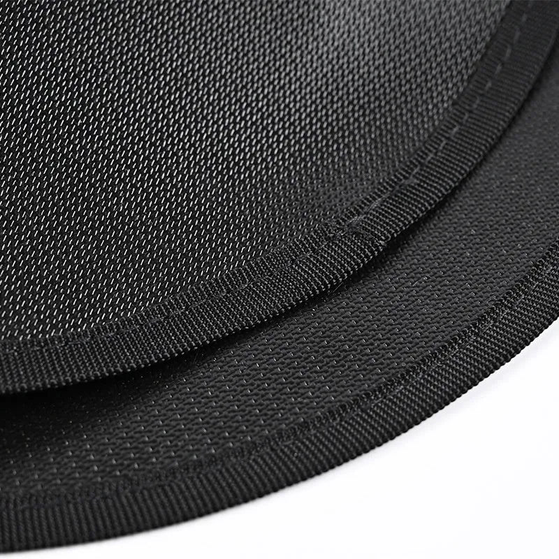 Black round fireproof barbecue mat on grass, available in 11 24 36 48 inch sizes