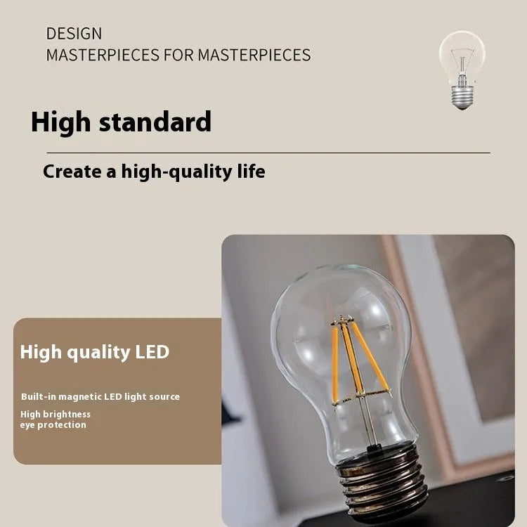 Iron art suspension bulb night lamp on a square wooden base for desktop decoration.
