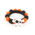 Halloween pet collar with a fur ball decoration in a pumpkin design, shown in size M.