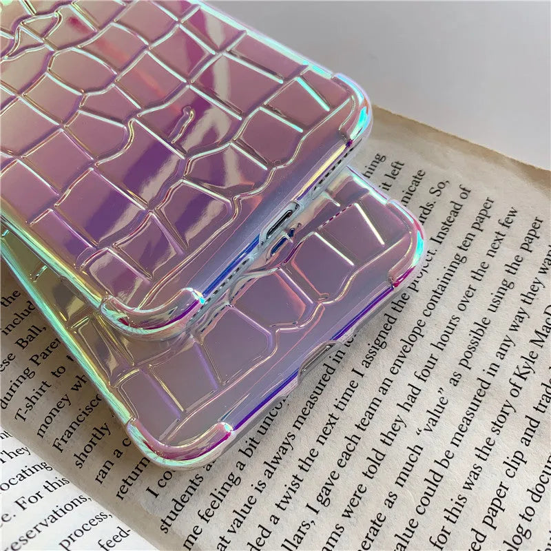 Silver glossy silicone laser phone case with textured surface for iPhone, showing lanyard hole and precise camera cutout.