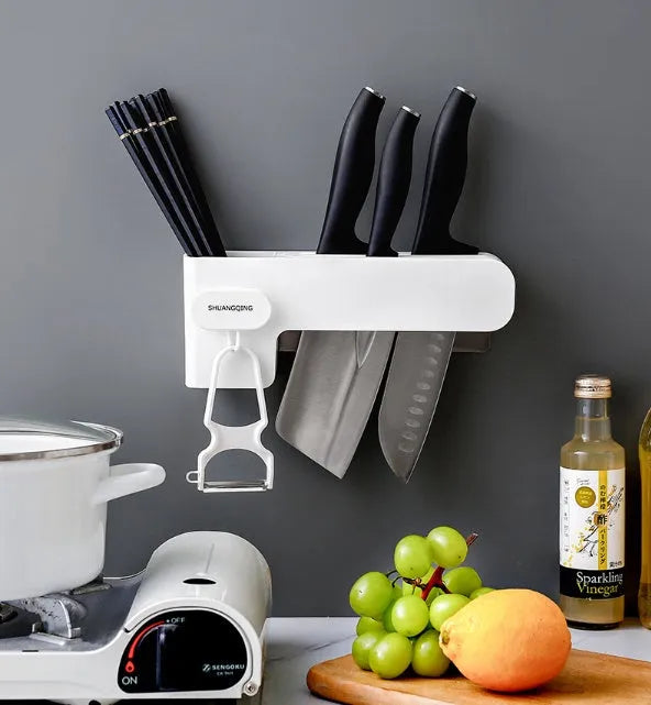 White plastic kitchen knife storage rack with compact dimensions on kitchen worktop