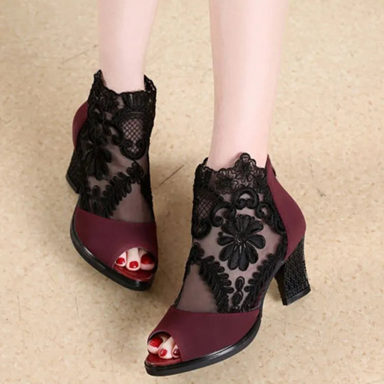 Black lace women's gladiator sandals with a square high heel and peep toe.