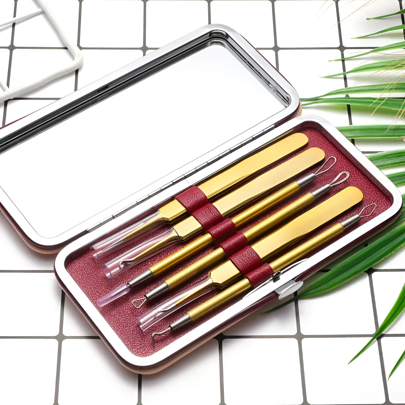 Six rose gold stainless steel acne remover pimple pins on a clean surface.