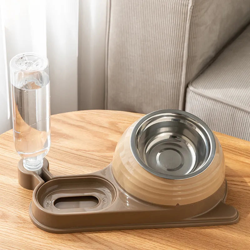 Brown automatic cat water dispenser and elevated food bowl set on a floor.