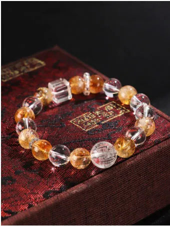 Handmade Huang Tajing beaded bracelet with freshwater pearl, yellow crystal, and white crystal beads