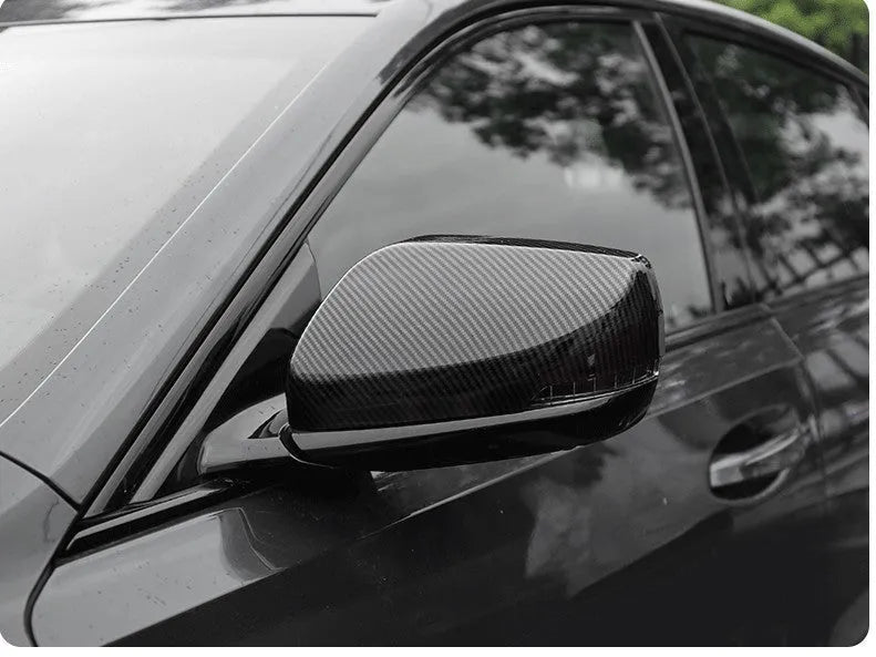 Pair of ABS rearview mirror covers for Cadillac CT5 CT6 in carbon fibre, silver, and rain frame styles.