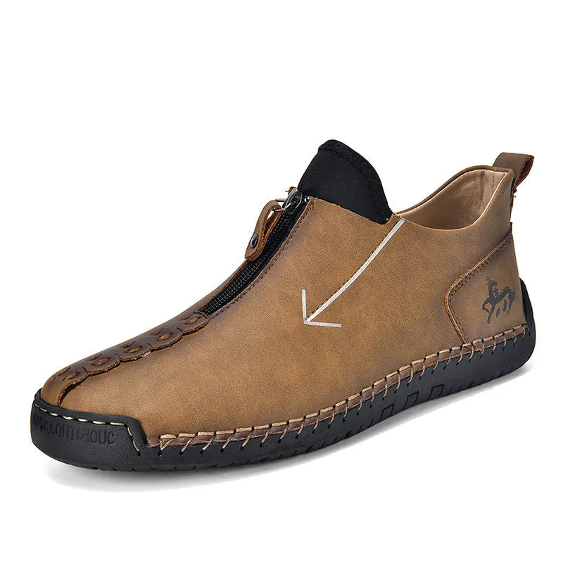 Men's brown front-zipper Martin boots with a round toe and mid-calf height on a rubber sole.