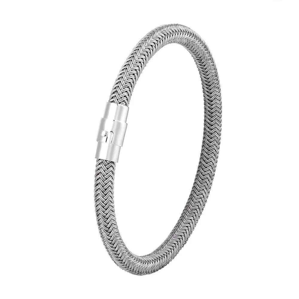 Geometric line design titanium steel bracelet with magnetic clasp on a wrist, showing adjustable sizing.