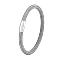 Geometric line design titanium steel bracelet with magnetic clasp on a wrist, showing adjustable sizing.