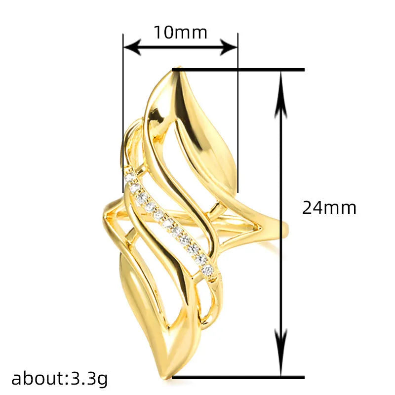 Gold women's ring with exaggerated curved design on a copper band, shown in casual style.