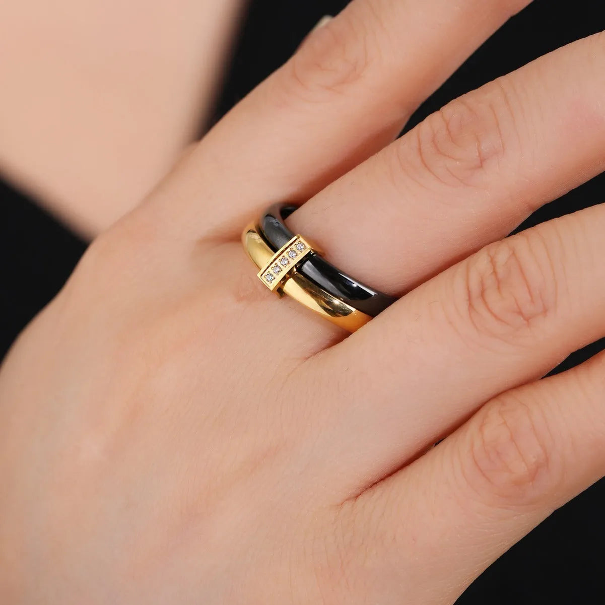 A glossy titanium steel women's double ring with a heart-shaped zirconium inlay, shown in steel white colour.