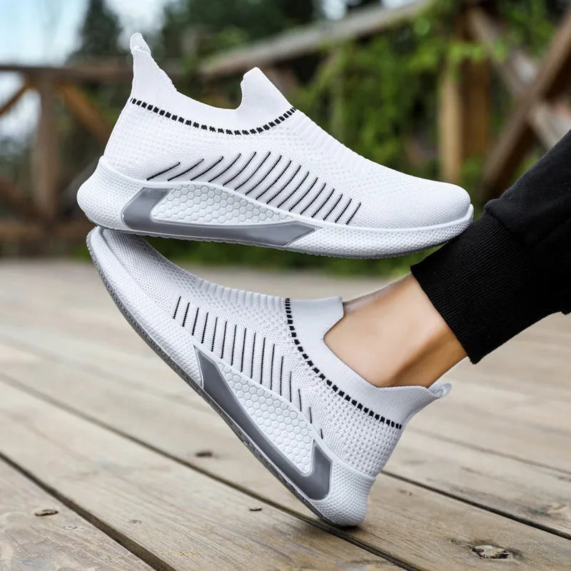 Men's black and white striped mesh slip-on sneakers with flyknit upper and lace-up front