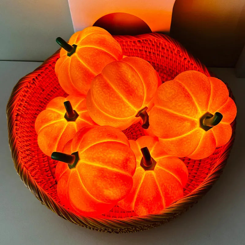 Pumpkin-shaped rechargeable decorative night light on a bedside table, 10.3 x 8 cm