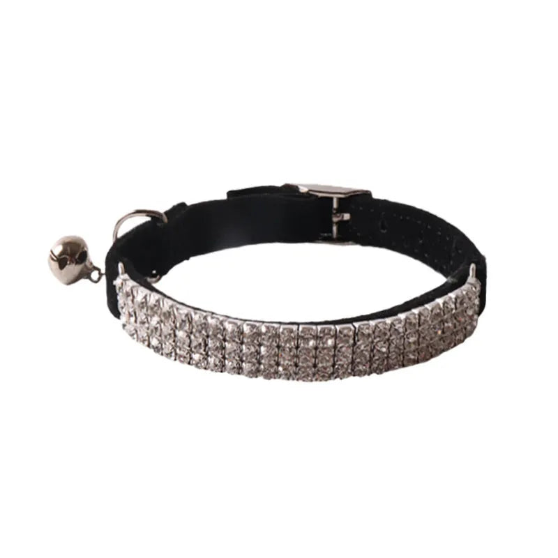 Elastic buckle cat collar in flocking fabric with gang drill detail, shown in multiple colours.
