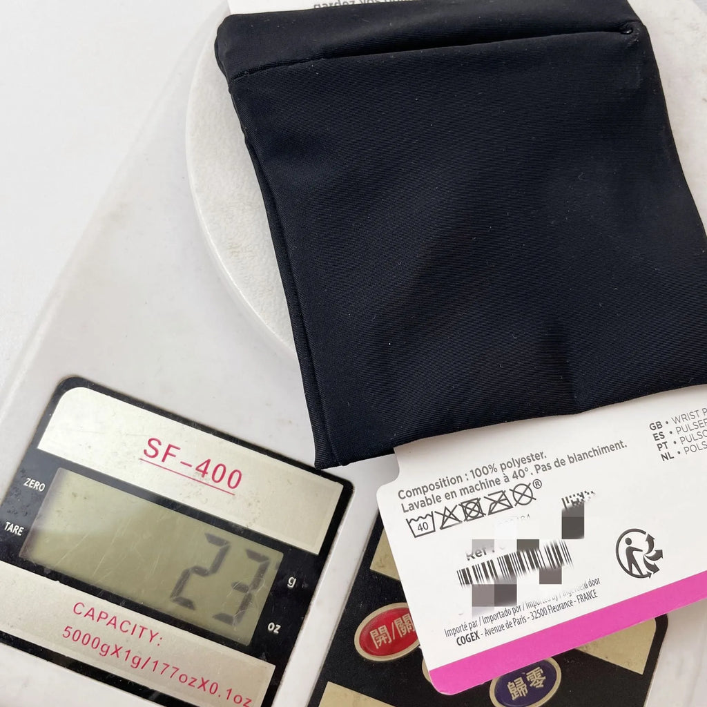 Black wrist bag armband sleeve with adjustable strap, shown holding a mobile phone, dimensions 10x10.5cm.