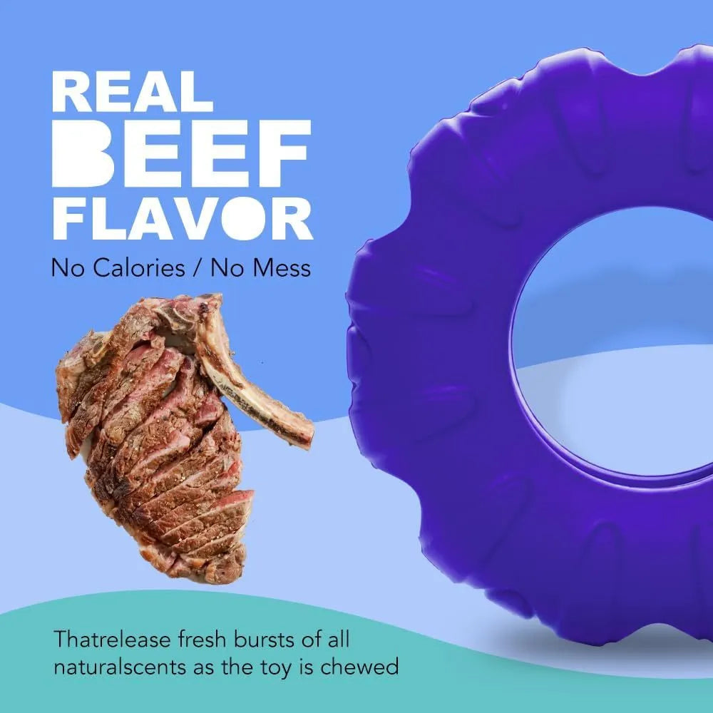 Blue, green, and red natural rubber tyre-shaped dog chew toy with oval openings for treat dispensing.
