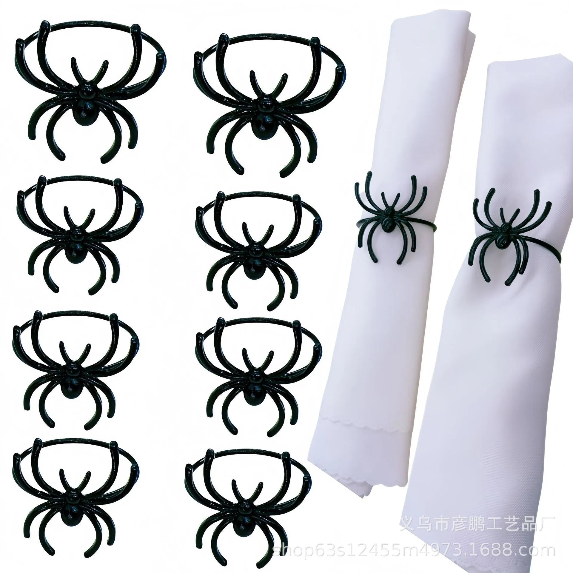 Set of six black alloy Halloween napkin rings with detailed spider design on a table setting.