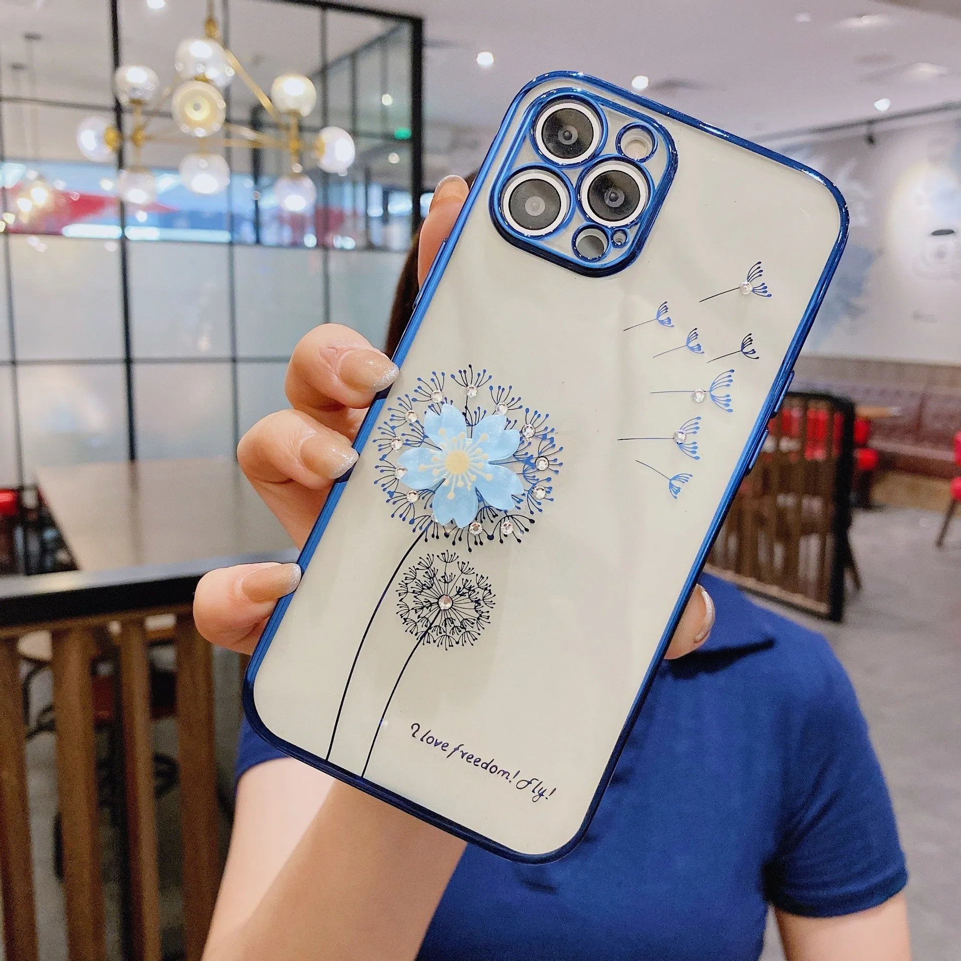 Green 3D floral design iPhone case with a rotating kickstand extended, showing the integrated screen protector.