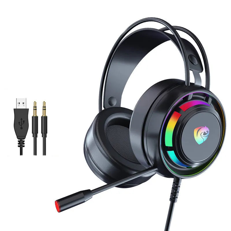 Black wired computer headphones with microphone, showing 3.5mm and USB plug options on a desk.