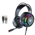 Black wired computer headphones with microphone, showing 3.5mm and USB plug options on a desk.