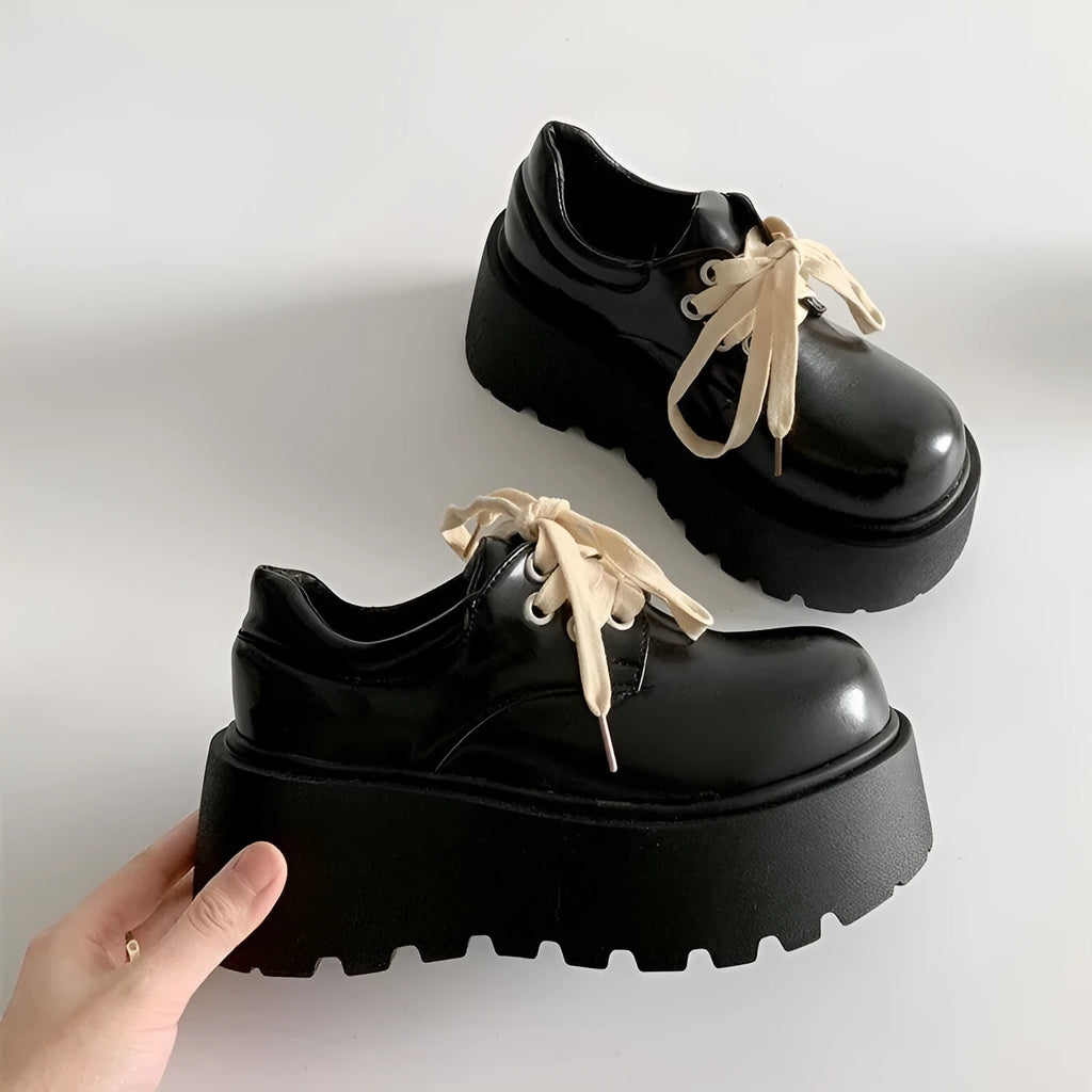 Women's matte black retro lace-up shoes with a thick rubber sole and chunky 6-8cm muffin heel.