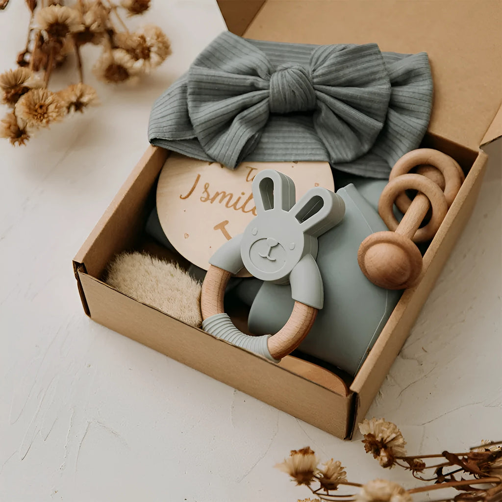 Newborn baby shower toy set with six bath toys in blue, peach, and brown options on a plain background
